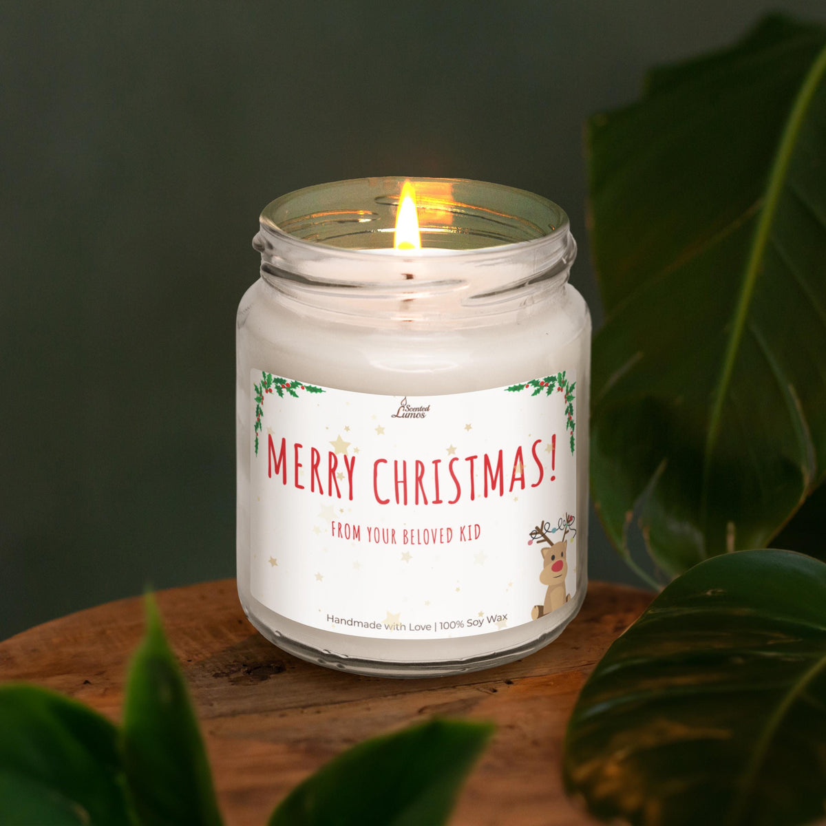 a lit candle sitting on top of a wooden table