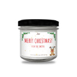 a christmas candle with a reindeer on it