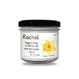 a jar of happy birthday candle with daffodils