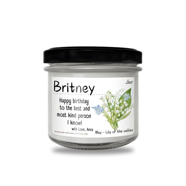 a jar of birthday candles sitting on top of a table