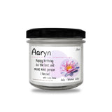 a jar of happy birthday candle with a flower on it