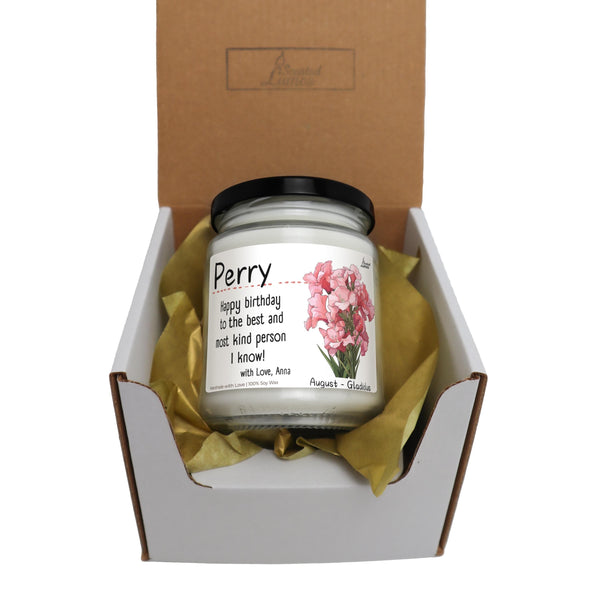 a jar of pink flowers sitting inside of a box