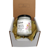 an open box with a candle inside of it