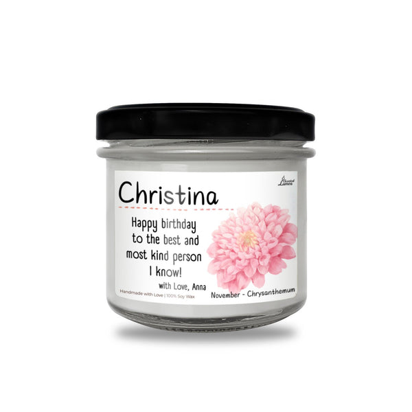 a jar of birthday candles with a pink flower