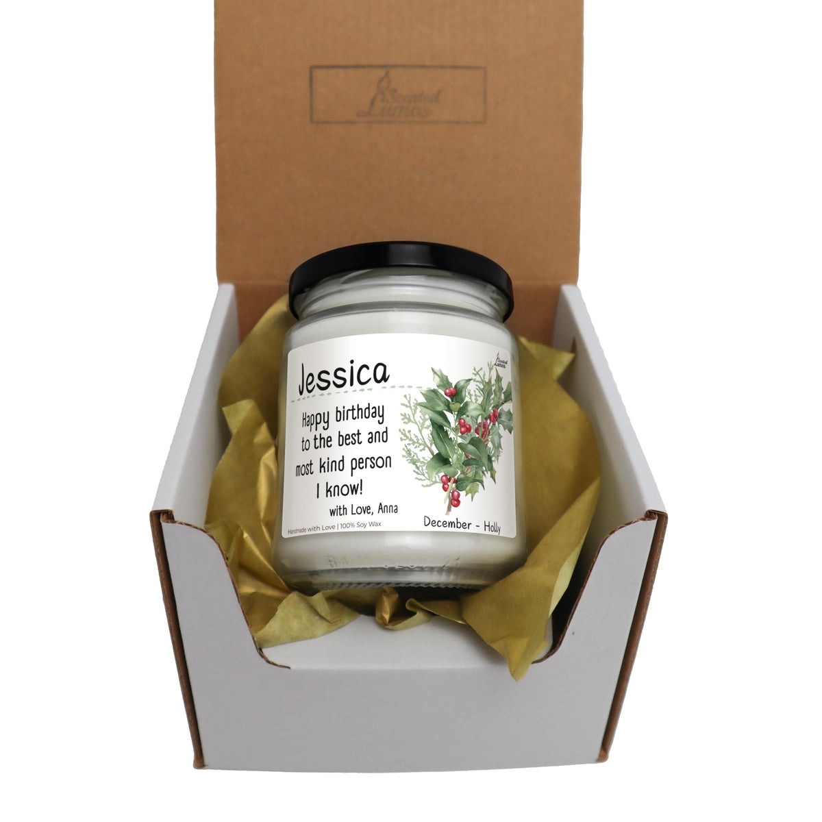 a candle in a box with a ribbon around it