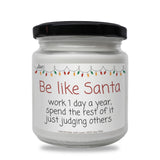 a white jar with a black lid that says be like santa