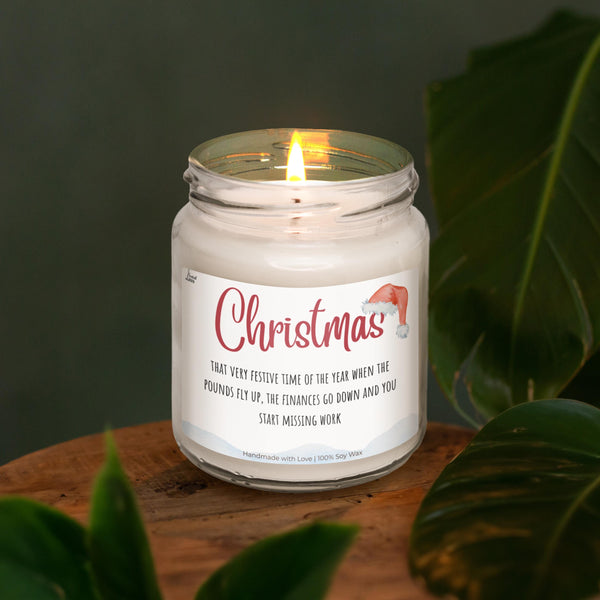 a white candle sitting on top of a wooden table