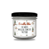 a glass jar with a black lid that says smell take the most magic time of