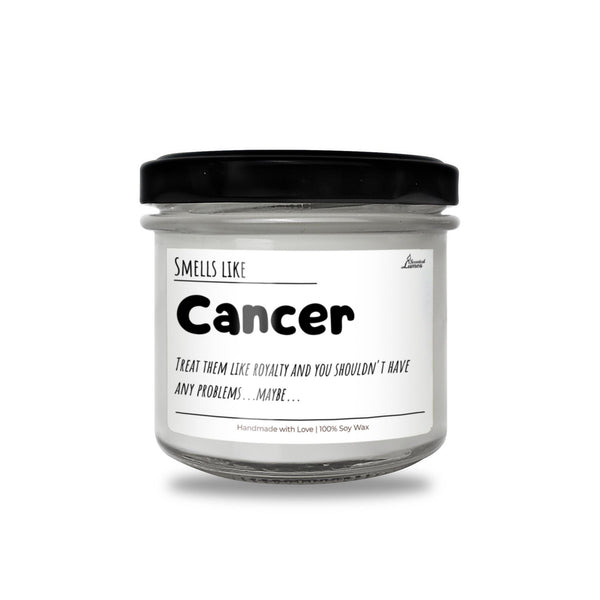 a jar of white candle with a black lid