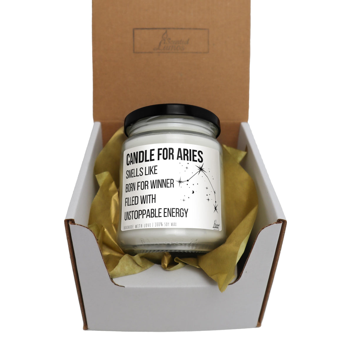 a candle in a gift box with tissue paper