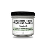 a christmas movie watching candle with a black lid