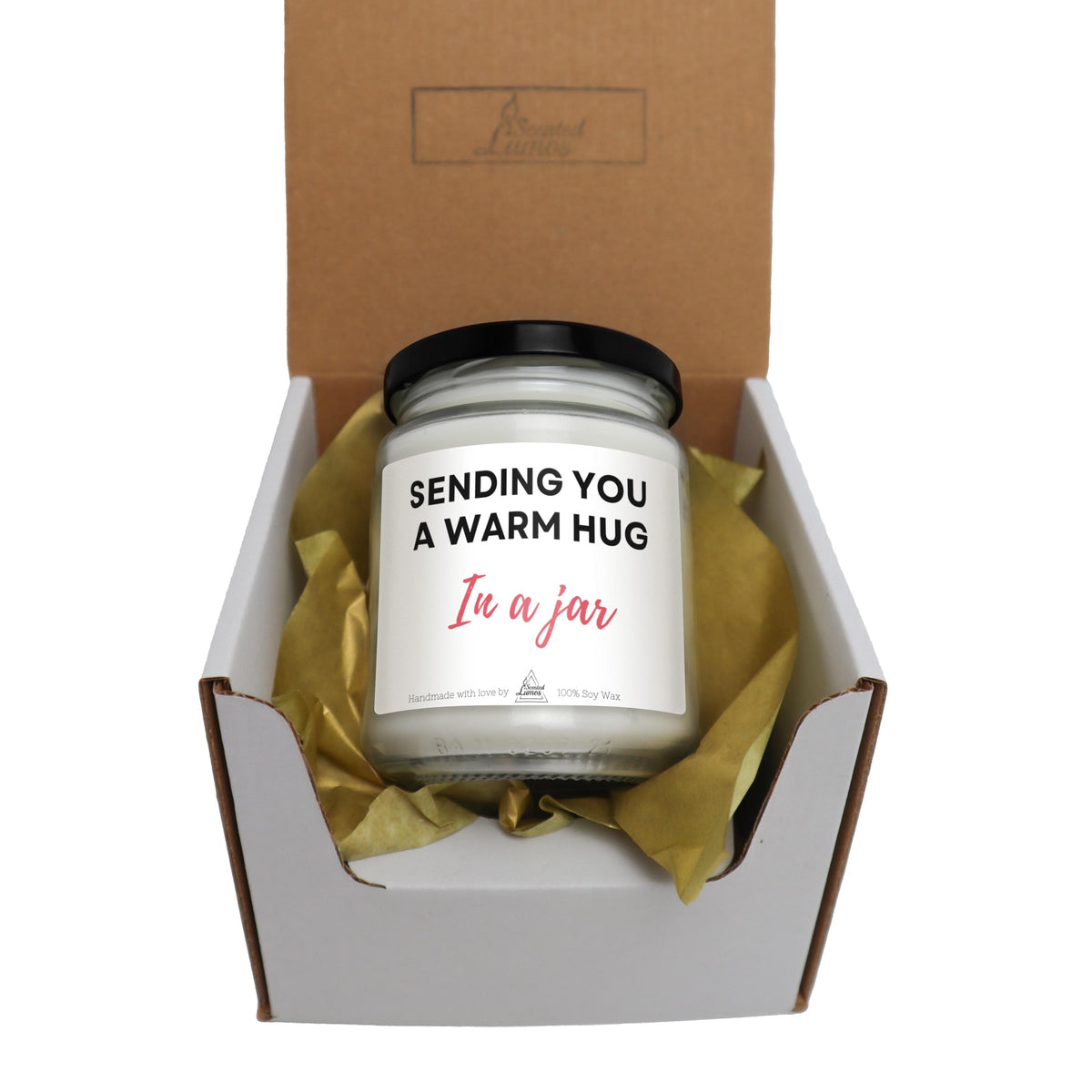 a candle in a gift box that says sending you a warm hug