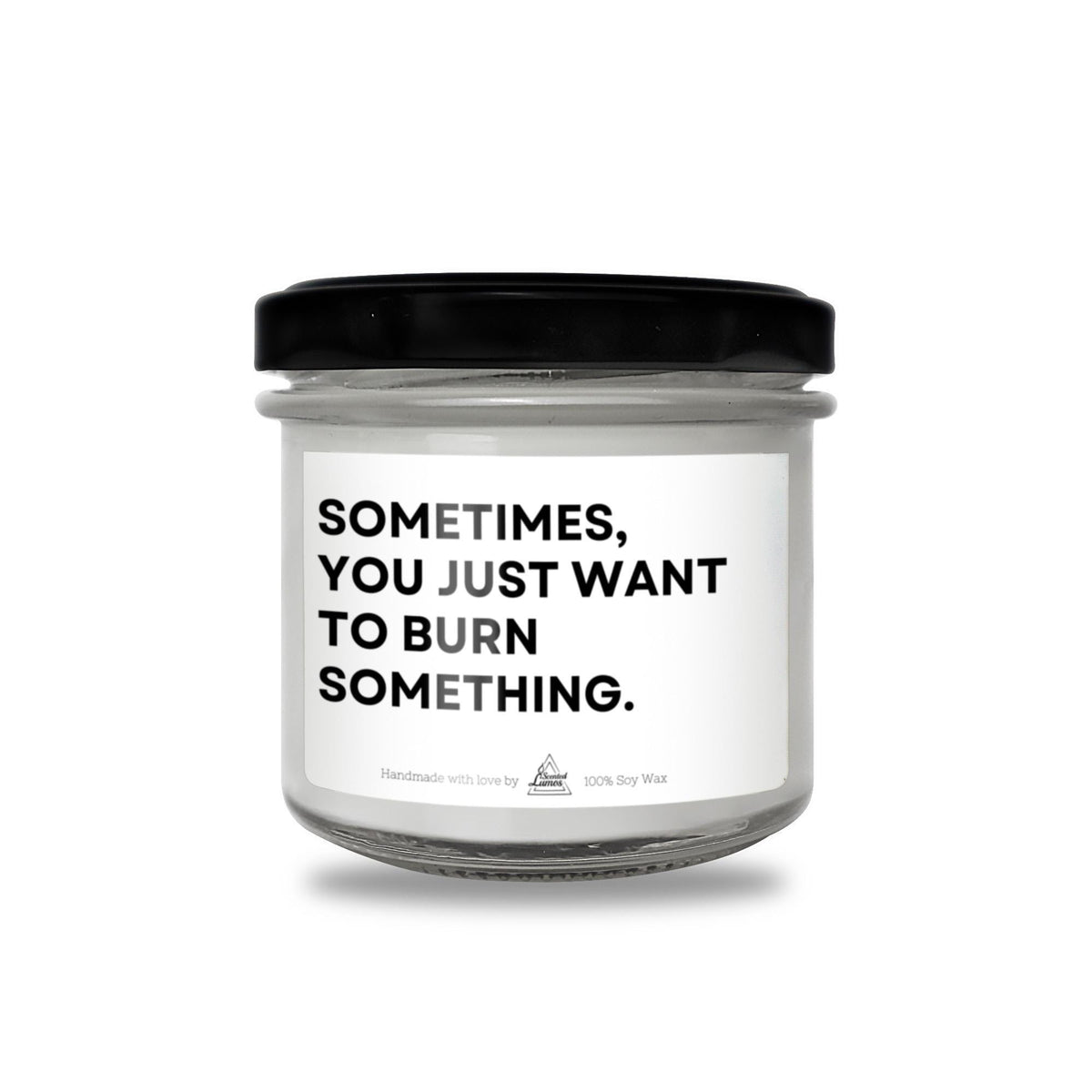 a white jar with a black lid that says sometimes you just want to burn something