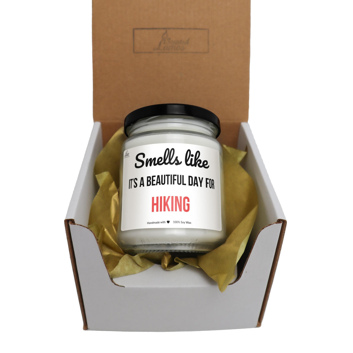 a small jar of hiking candle in a box