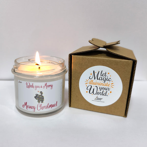 a white candle sitting next to a brown box