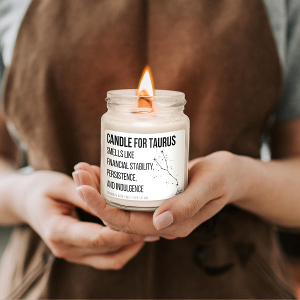 a person holding a candle in their hands