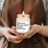 a person holding a candle with a message on it