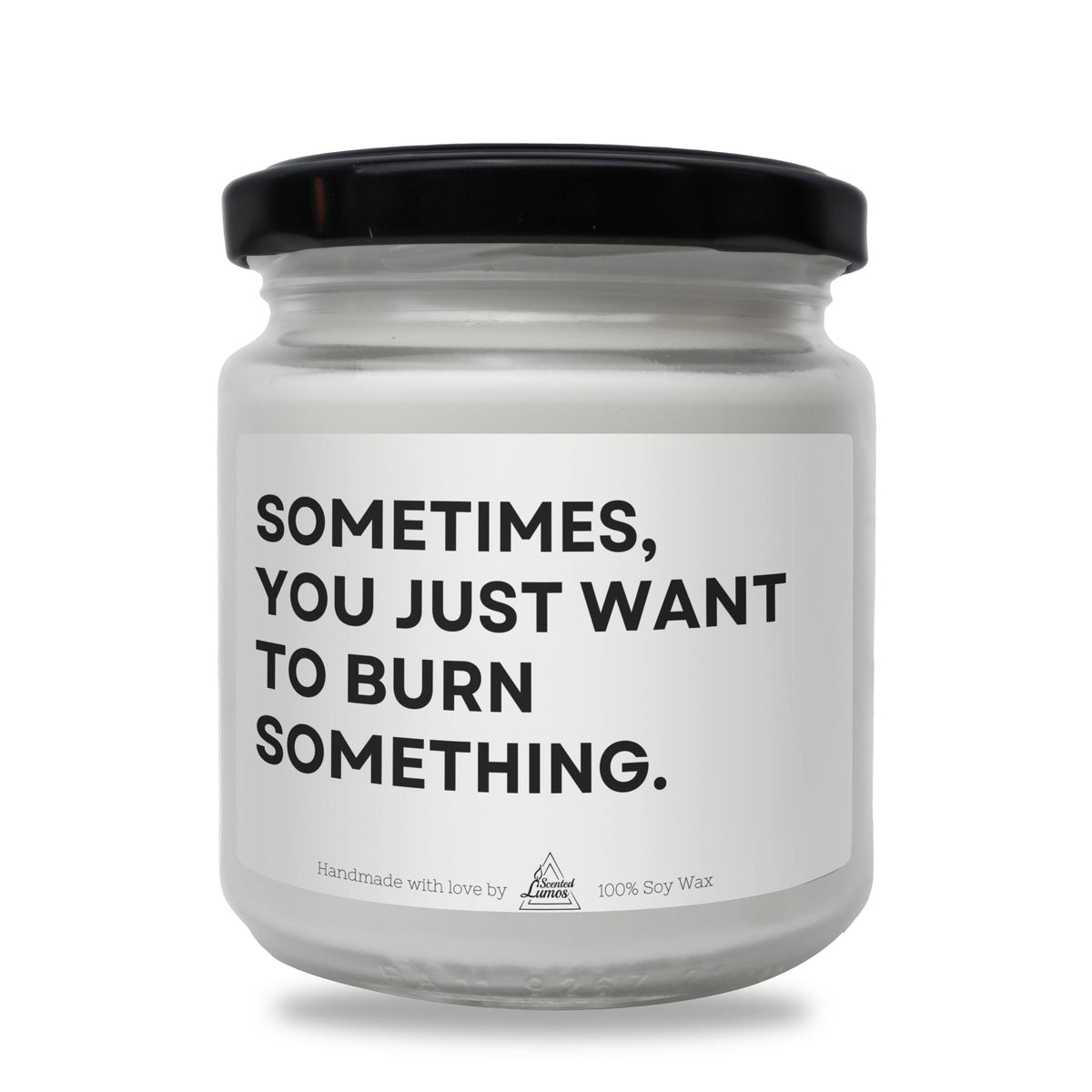 a white jar with a black lid that says sometimes you just want to burn something