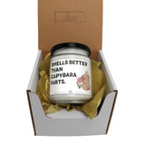 a candle in a box that says smells better than capybara parts