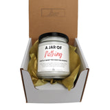 a jar of nutriting sits in a box