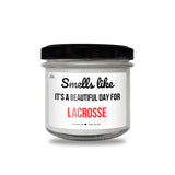 a jar of small white candles with a black lid