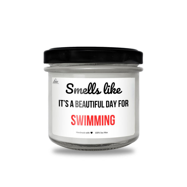 a jar of white and black candle with a black lid