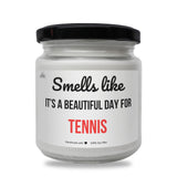 a jar of tennis balls with the words smell like it's a beautiful day